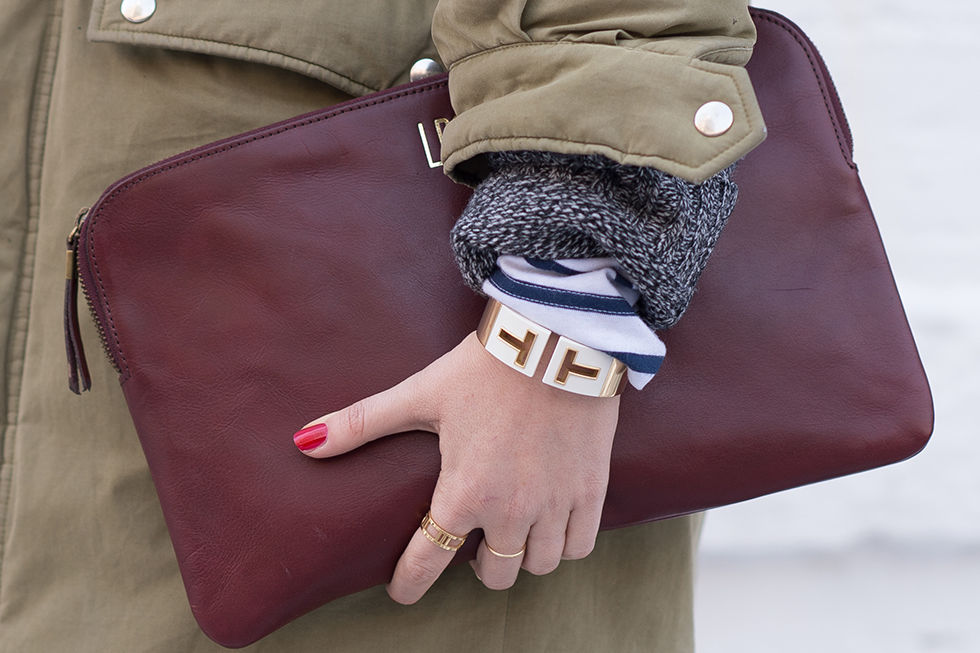 Pictured here: Tiffany & Co. Tiffany T Cutout Cuff  In 18k Gold With White Ceramic, $8,500; tiffany.com and Atlas Open Ring in Rose Gold, $850; tiffany.com