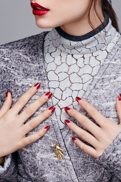 Forgo the standard pink-and-white polish combo for a blood-red hue, such as Deborah Lippmann Nail Lacquer in Lady Is A Tramp. Add a sliver of negative space, as Kawajiri did here, for some modern French flair.
