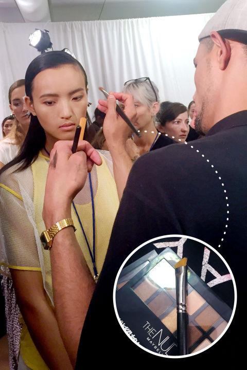 The angle brush found in Maybelline New York's Brow Drama Pro Palette was modeled after makeup pro Yadim's (the man responsible for Rihanna's intense arches for the cover of her hit single, "BBHMM") "brow triangle." The face painter was spotted wielding his bespoke brush behind these scenes at DKNY's Spring 2016 show, noting: "It's stiff so you have a lot of control with it, but it also offers flexibility." The tool's angular shape makes it ideal for filling in the wider parts of the brow, while the pointed tip devises a sharp tail. "Instead of making [the models' natural shape] heavier or darker, I filled in where needed to remove any strong hikes or peaks in the brow to make it a bit straighter," he explains of his backstage approach. To craft your own customized version, cut the bristles of a flat concealer brush on a crisp diagonal. For touch-ups on the go, use the scaled-down version with a pinky-size handle included in the Maybelline palette.
