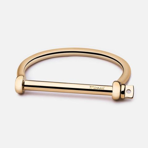 Face it, arm parties are kind of dead and gone. Instead, go with one simple gold cuff that has a little bit of personality. Miansai Screw Cuff Bracelet, $200; miansai.com