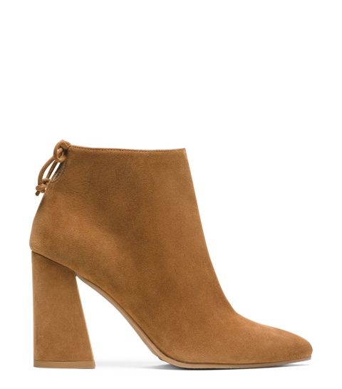 Booties, specifically camel colored booties, go with everything from skinny jeans and skirts to flares and culottes. Team these with pieces in the same color family, other neutrals, or even vibrant shades like red and and green.