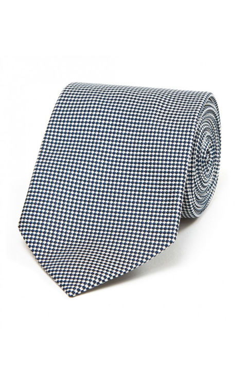 If you're going to take the classic route and give a man a tie, give one from Drake's. The old-school British brand is world-renowned for crafting them from high-quality silks and wools in refined prints and cuts. Drake's Navy and Silver Chequer Woven Silk Jacquard Tie, £105; drakes.com 