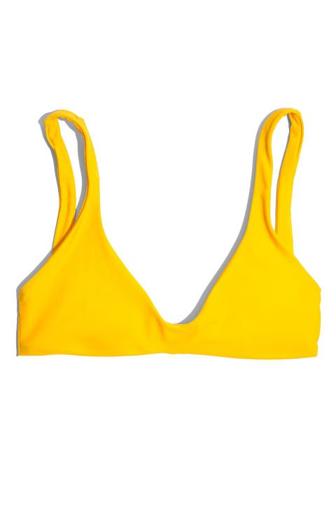 Looking like you're always ready for a chic pool party is part and parcel of keeping Coachella-cool. Wearing a bikini as you would a crop top is also key for allowing maximum airflow.Madewell x Bikyni Plunge Bikini Top, $55; madewell.com