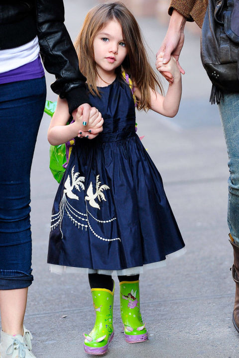 Here, she wears a Holmes & Yang dress and neon green wellies.