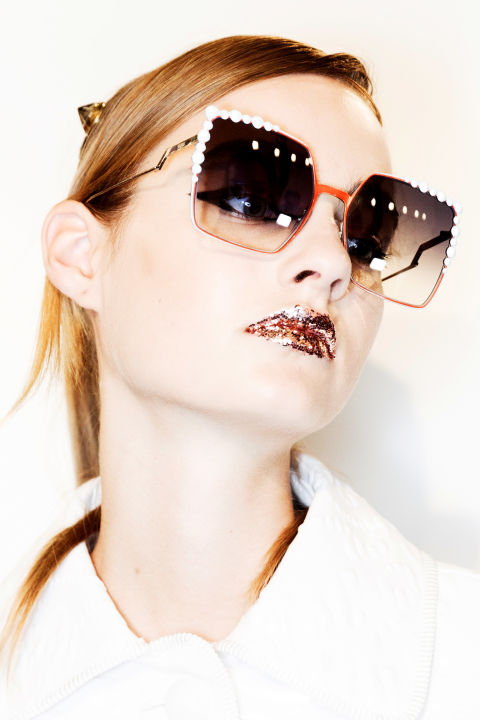 Seen at Mary Katrantzou, DKNY, and especially at Fendi, where
pouts were covered in glitter, "bold statement lips are taken to the next level
by creating new dimensions, from ombre effects to an overlay of glitter," says
Martin. For a super easy look that doesn't look it, layer two different
effects, such as a base layer of a satin-y lipstick with a dab of high-glitter
gloss right in the center of your lips.